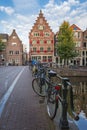 Bicycles parked on a bridge across the canal Oudezijds Voorburgwal in the Red light District Royalty Free Stock Photo